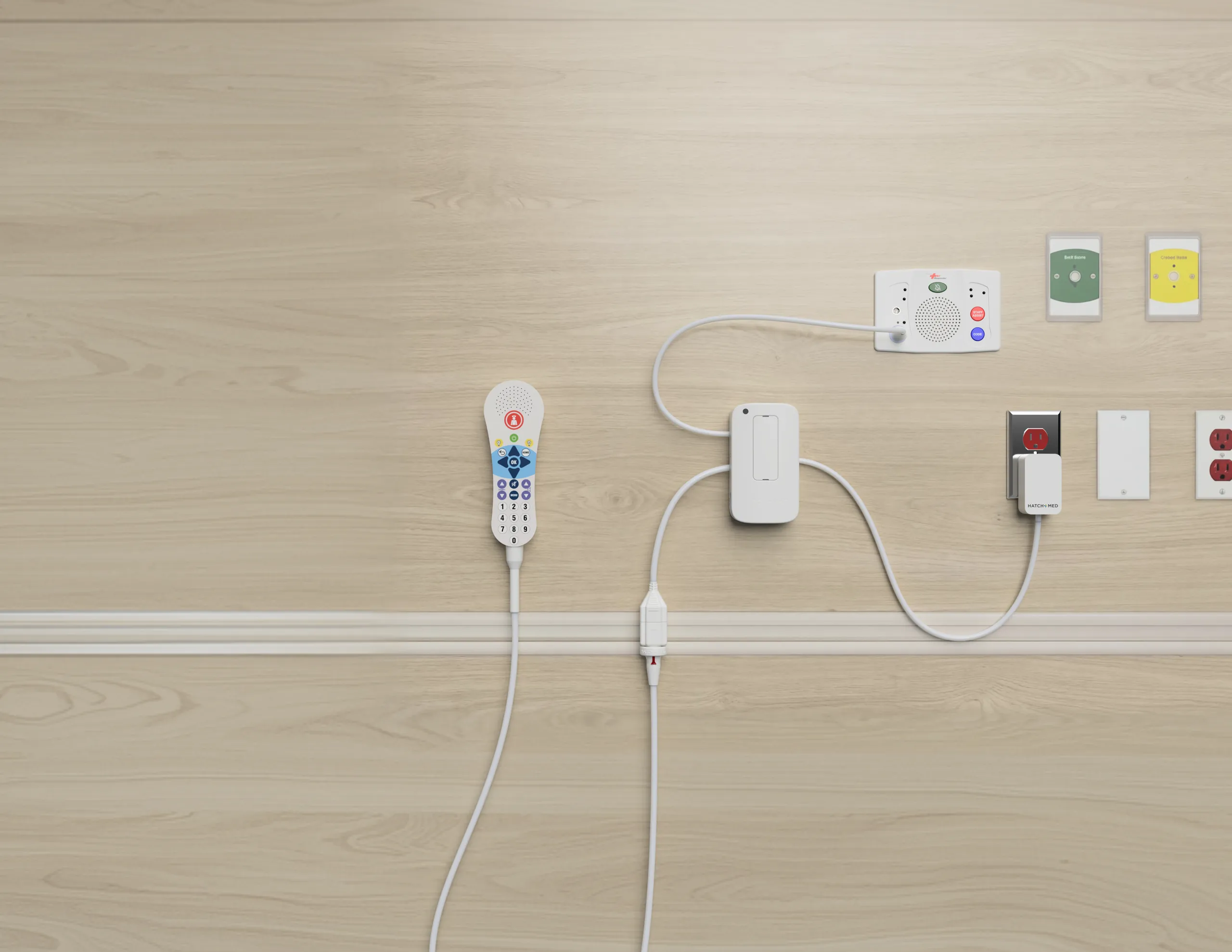 HighLightX mounted on a hospital headwall, connected to the nurse call patient station alongside the pillow speaker